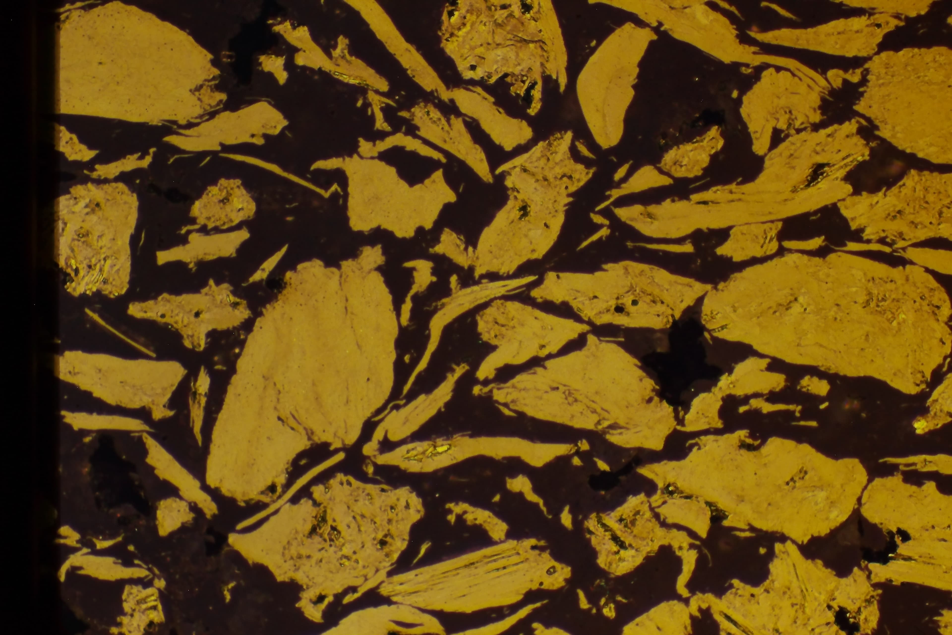 Polymer-graphite composite microstructure at 200X magnification, showing proper preparation with intact fibers and clear matrix-fiber interface